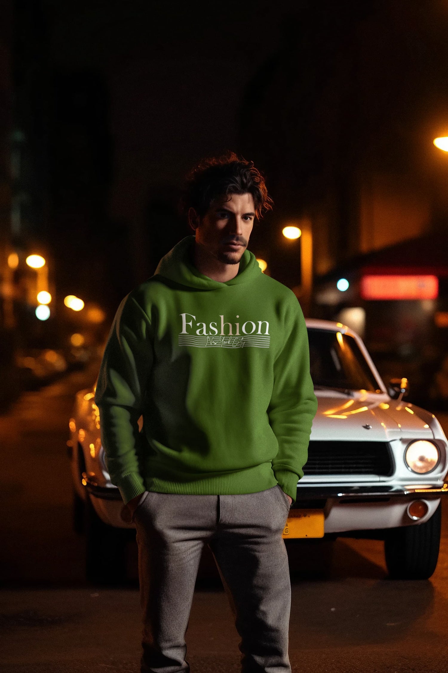 Man wearing a green hoodie with &