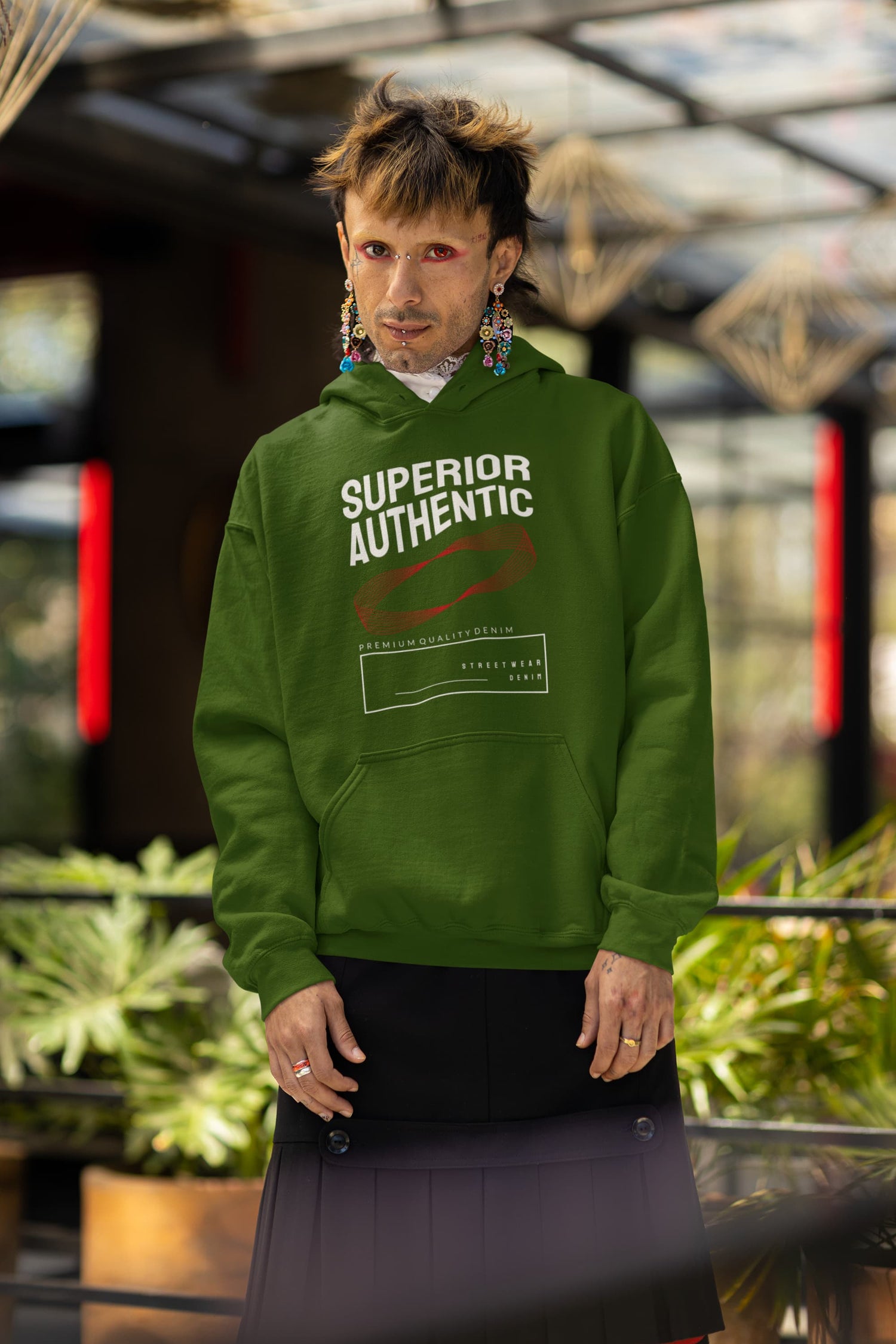 Person wearing a green hoodie with &
