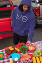 Person in a blue hoodie with &