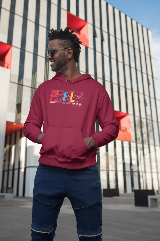 Man wearing a red hoodie with &