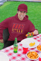 Person wearing a maroon hoodie with &