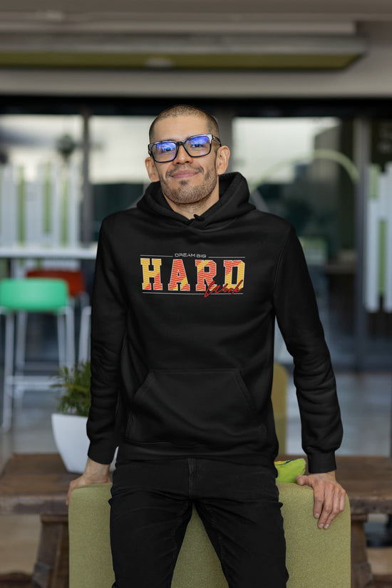 Man wearing a black hoodie with &