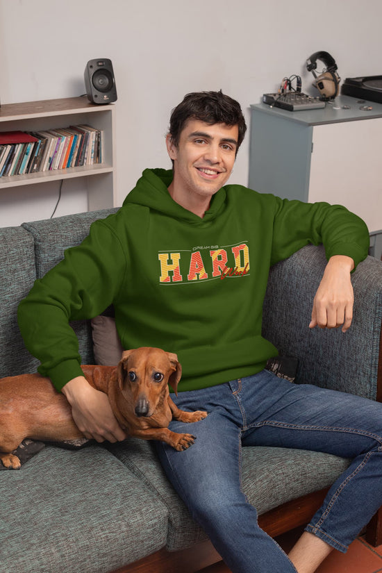 Man wearing a green hoodie with &