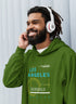 Man wearing a green hoodie with &