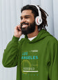 Man wearing a green hoodie with &