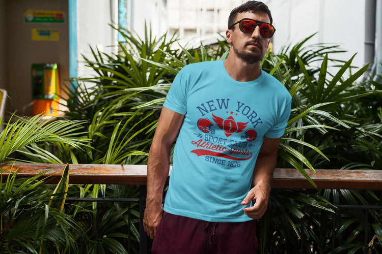 Man wearing a blue t-shirt with &