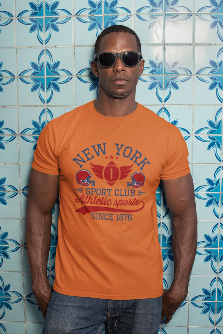 Man wearing an orange t-shirt with &