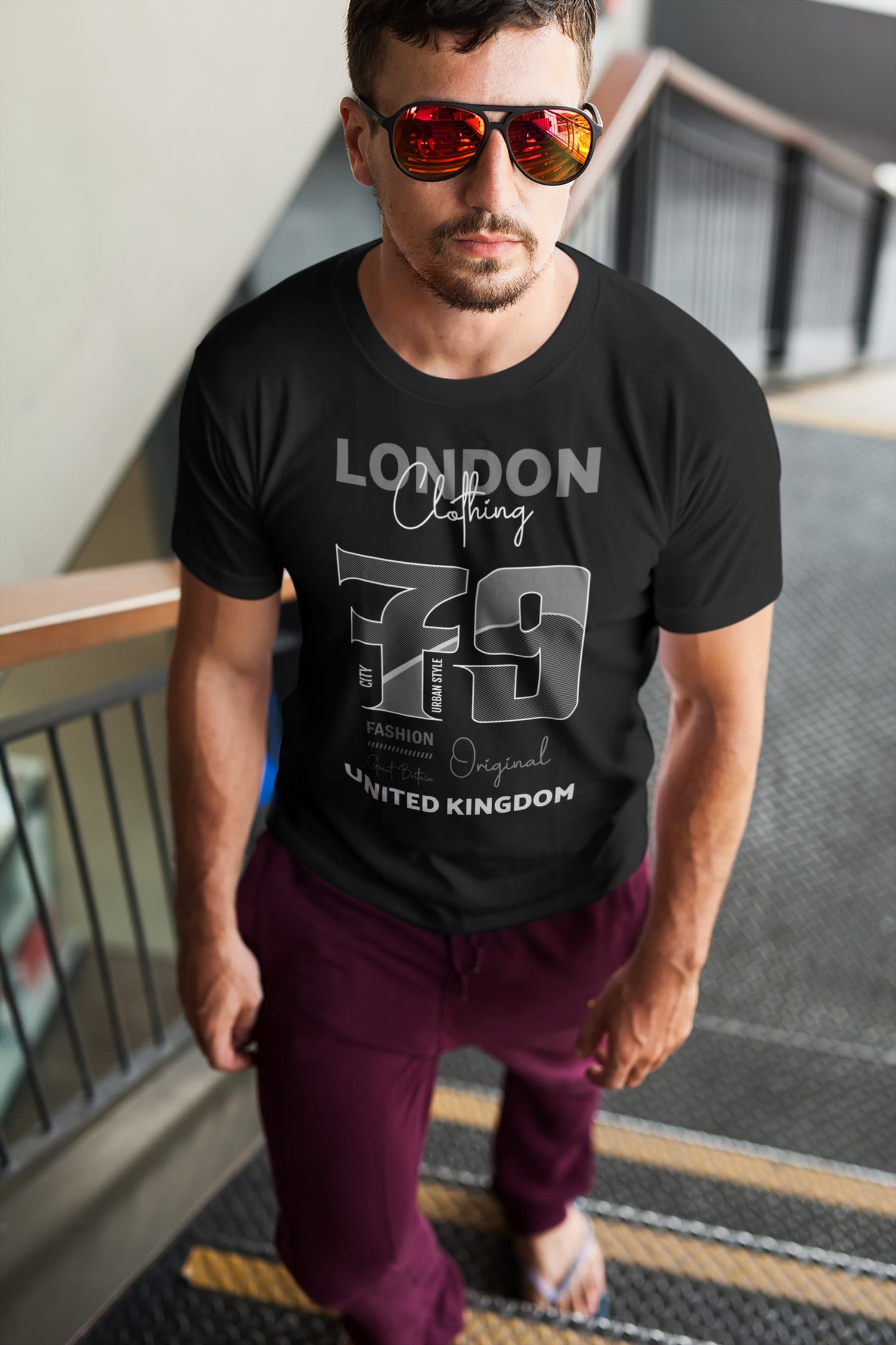 Man wearing a black t-shirt with &