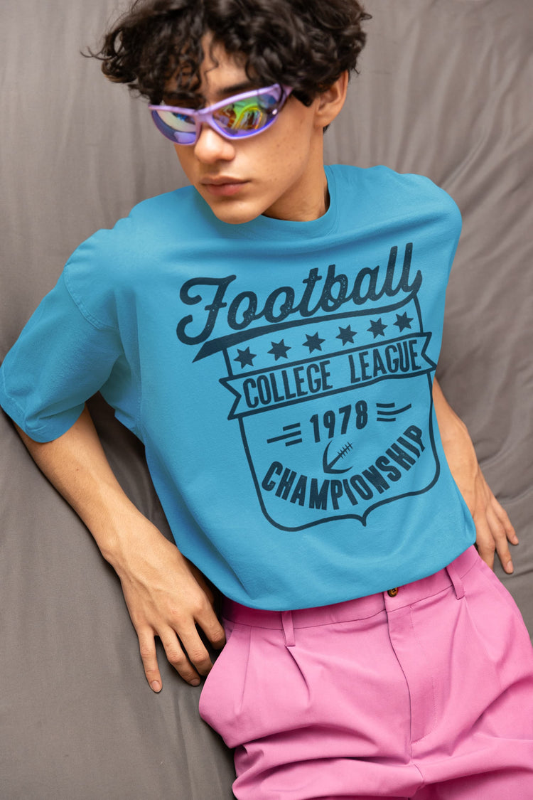 Person wearing a blue t-shirt with &