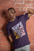 Man wearing a purple t-shirt with text against a brick wall