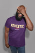 Man wearing a purple t-shirt with &