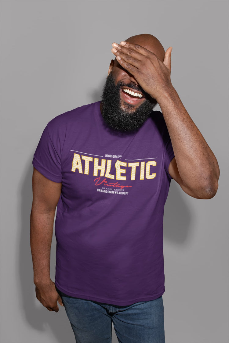 Man wearing a purple t-shirt with &