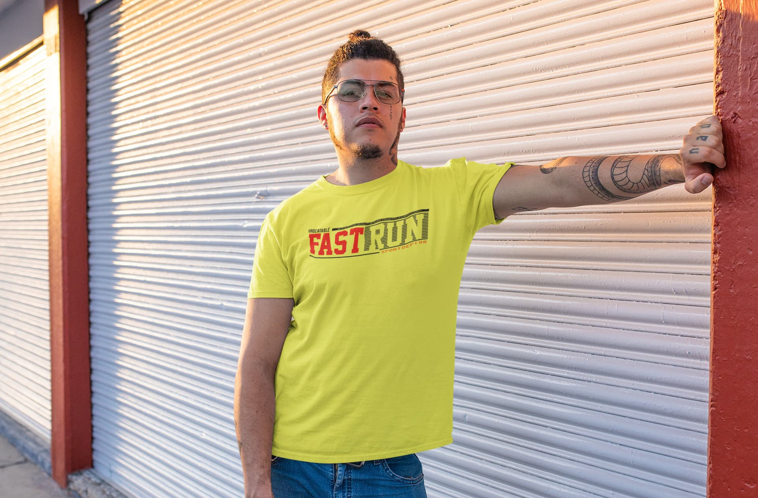Person wearing a bright yellow t-shirt with &