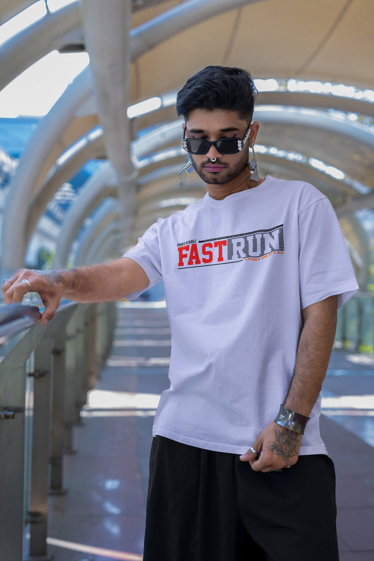 Man wearing a white t-shirt with &