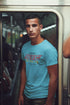 Man wearing a blue t-shirt with &