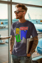 Man wearing a t-shirt with colorful text at an airport