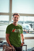 Man wearing a green t-shirt with &