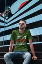 Man wearing a green t-shirt with &
