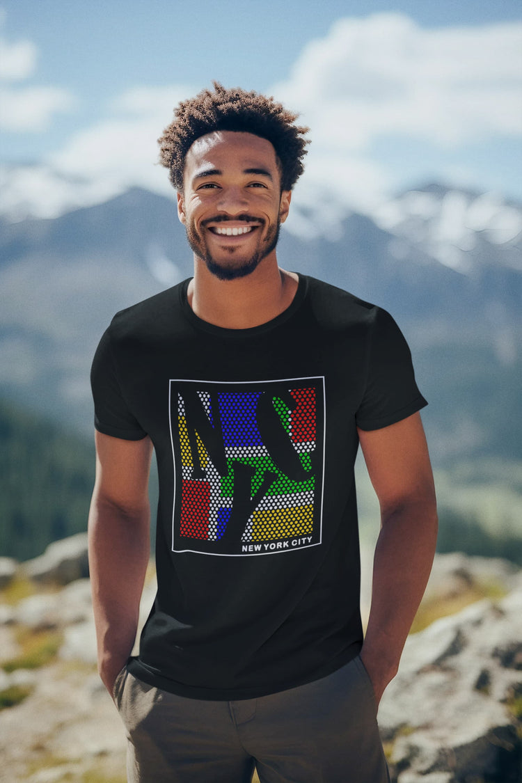 Man wearing a black t-shirt with colorful graphic design outdoors