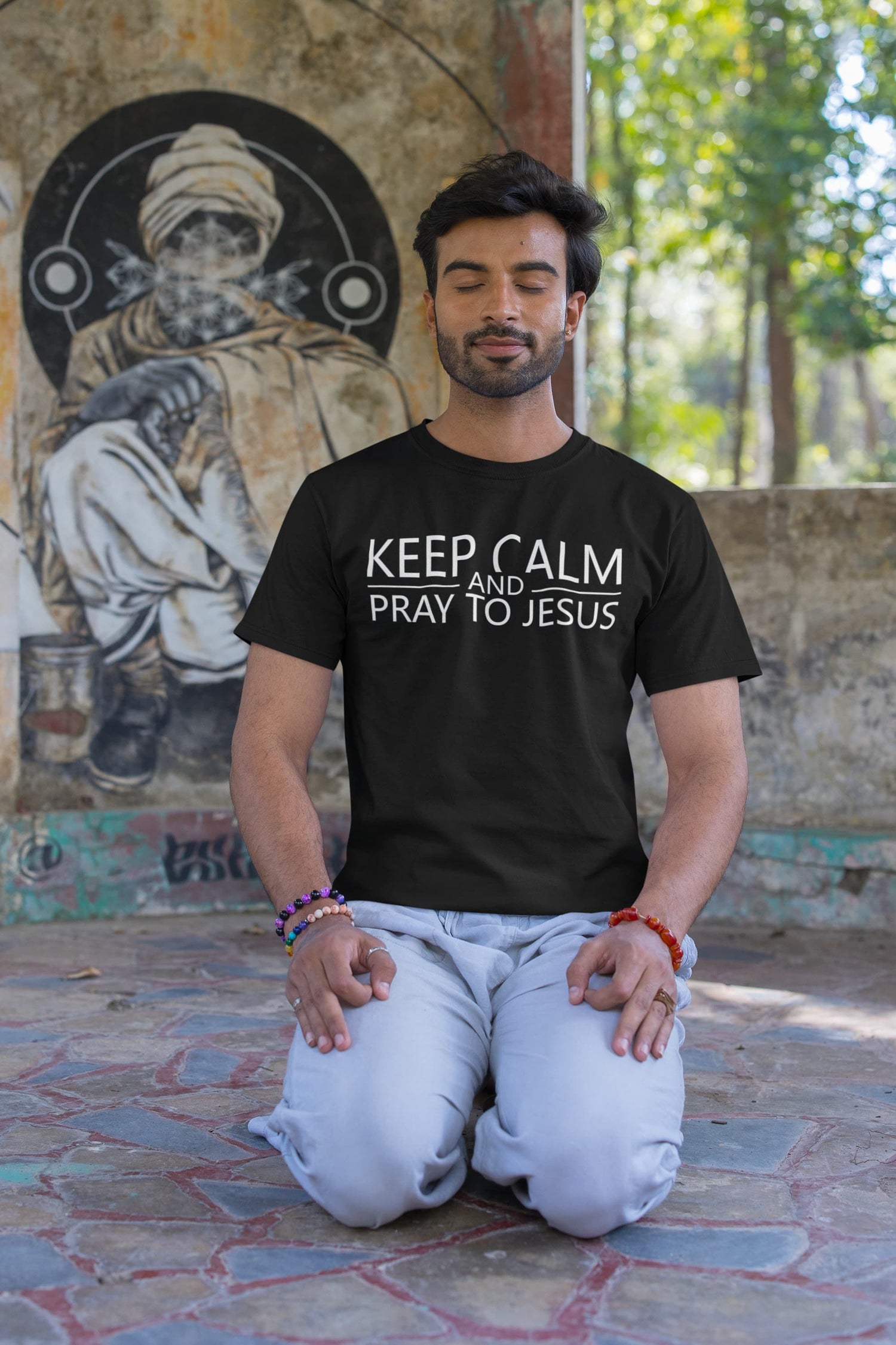 Man wearing a black t-shirt with &