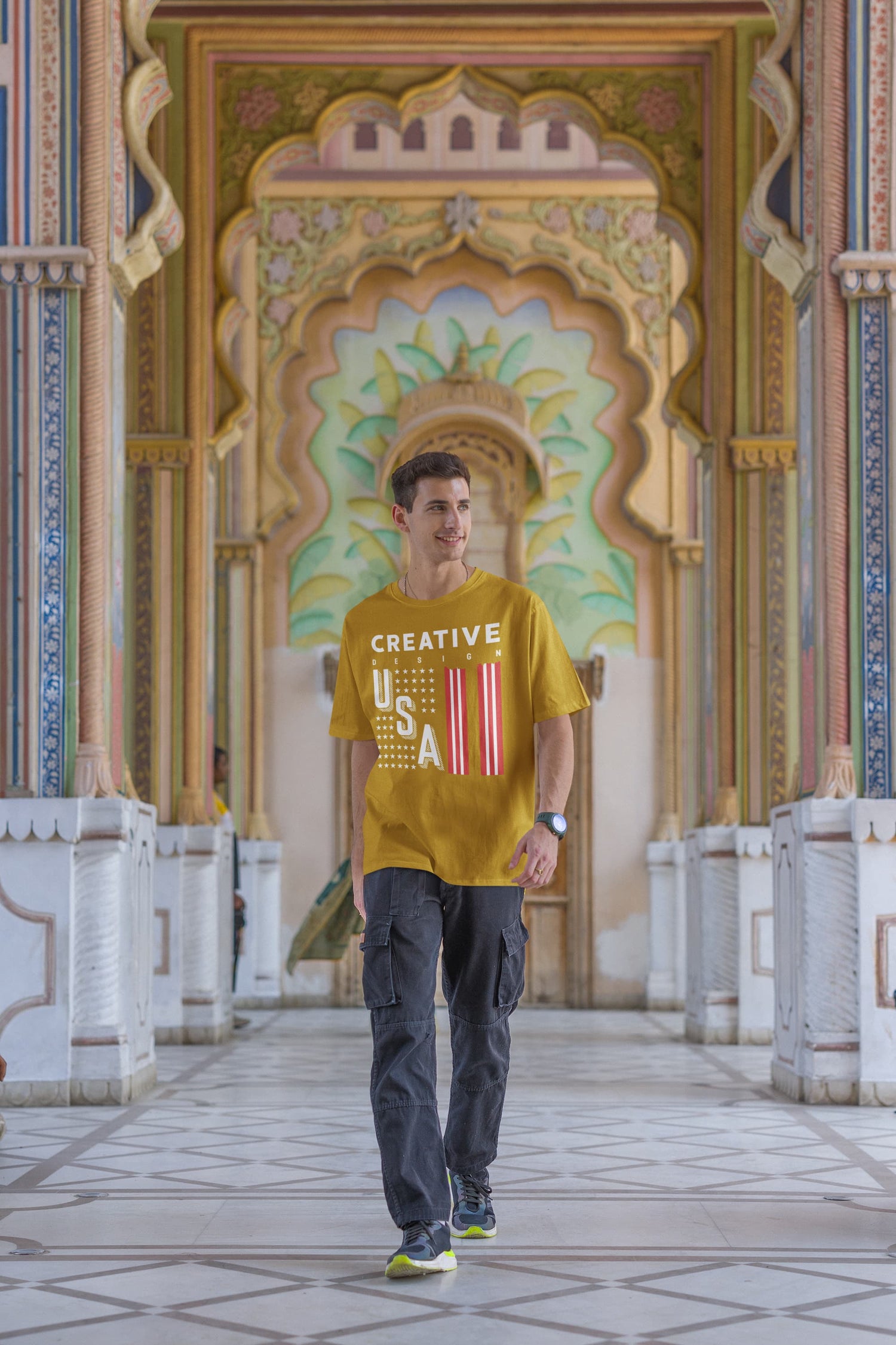 Man wearing a yellow t-shirt with &