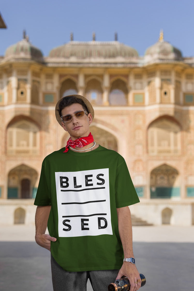 Person wearing a green t-shirt with &