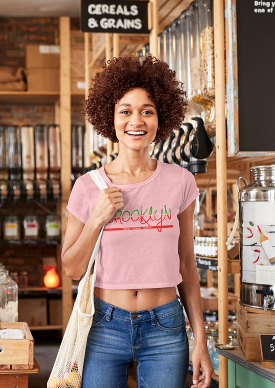 Woman wearing a pink t-shirt with &