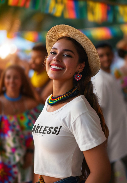 Woman wearing a white 'ARLESSI' shirt with a straw hat in a festive setting