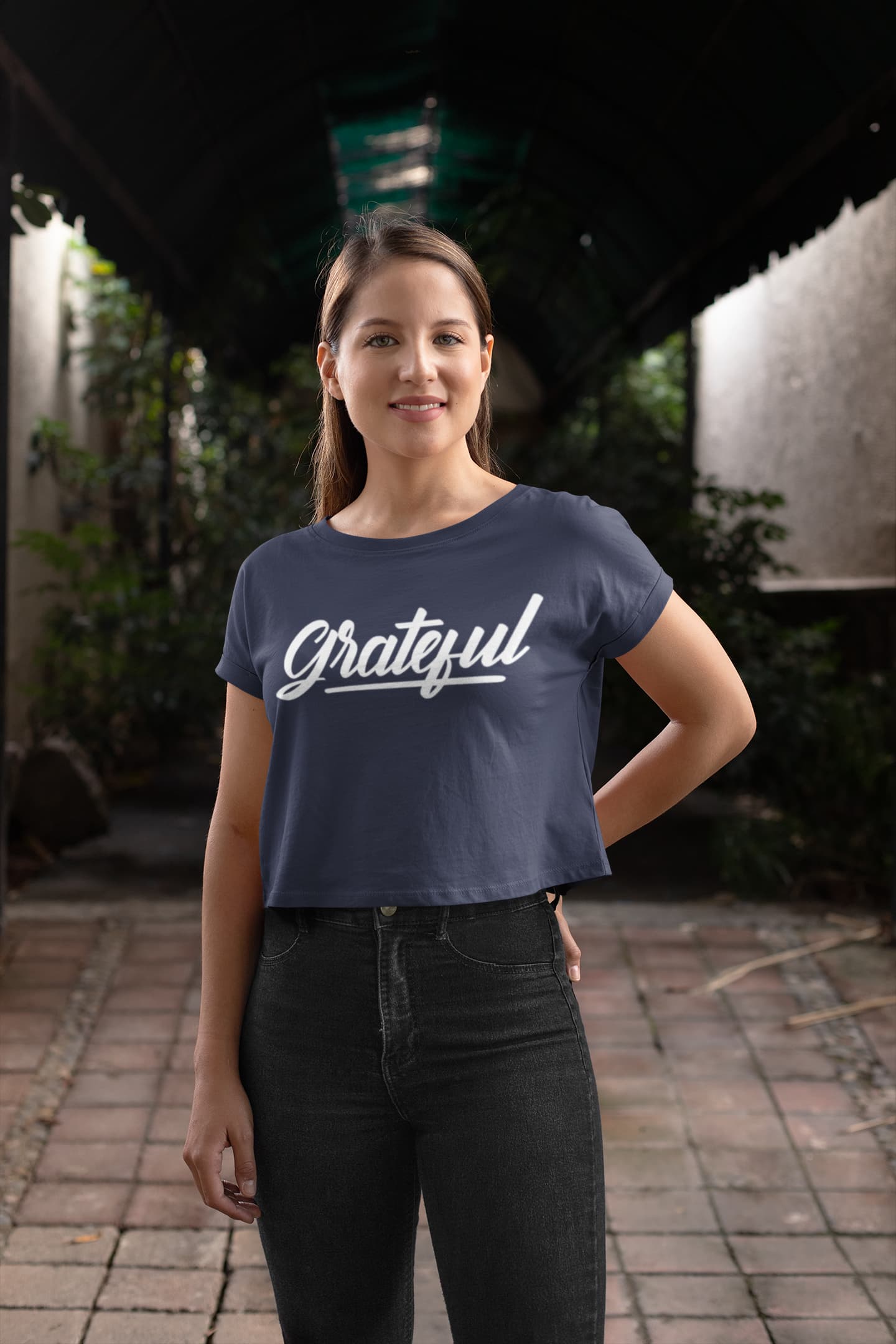 Woman wearing a navy blue t-shirt with &