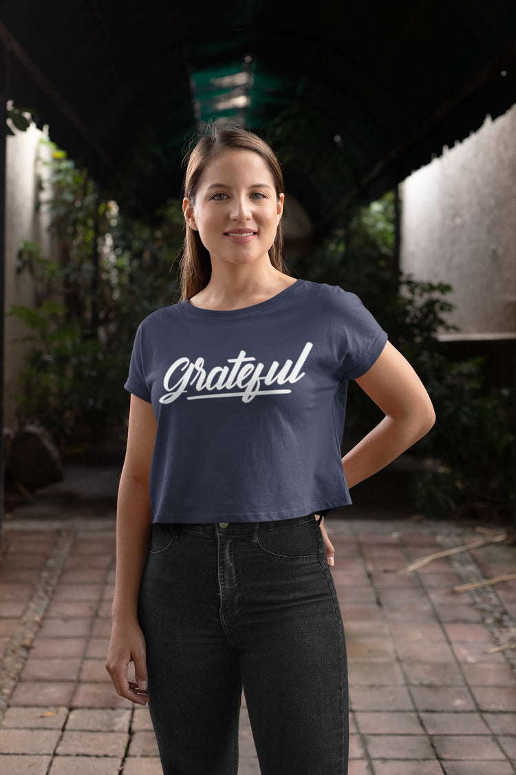 Woman wearing a navy blue t-shirt with &
