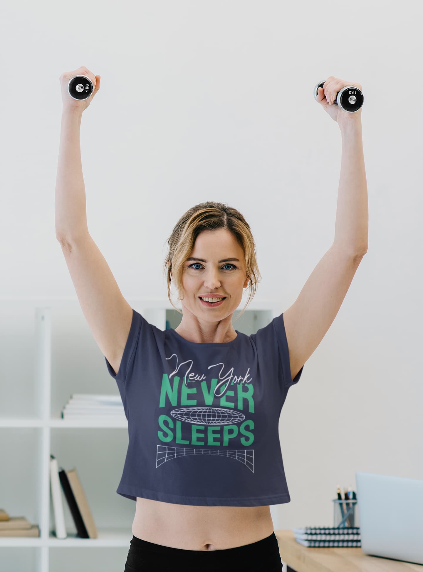 Woman exercising with dumbbells wearing a t-shirt with &