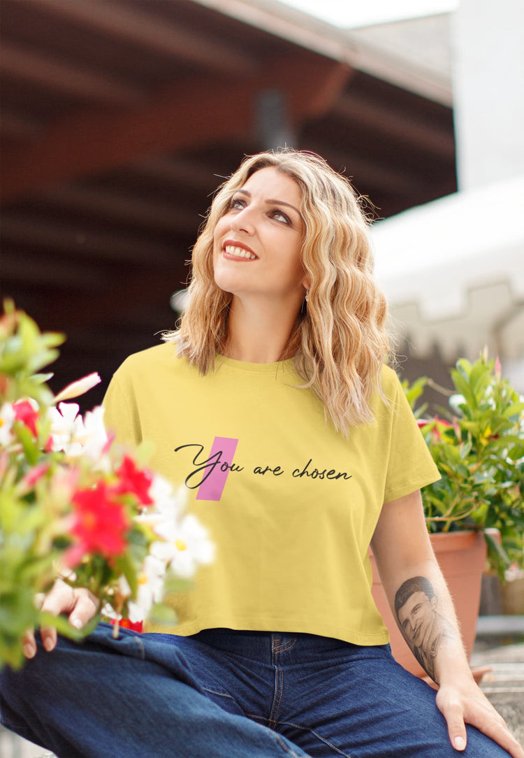 Woman wearing a yellow t-shirt with &