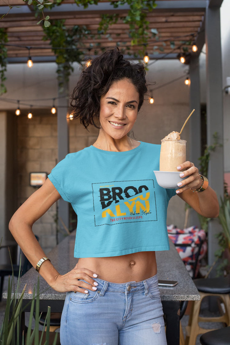 Woman wearing a blue crop top with &