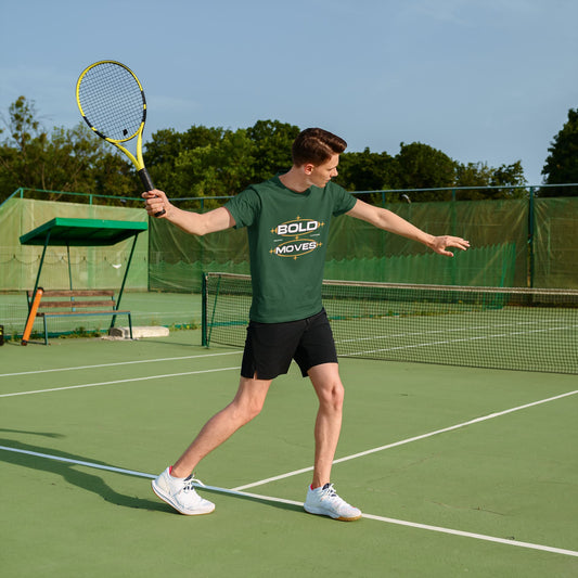 Person playing tennis on a court with a green t-shirt and racket.