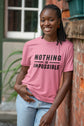Woman wearing a pink t-shirt with &