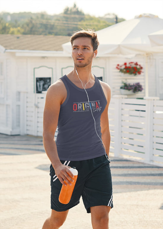 Man in athletic wear holding an orange bottle on a rooftop with white buildings and greenery in the background