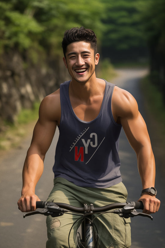 Man riding a bicycle on a road with greenery in the background