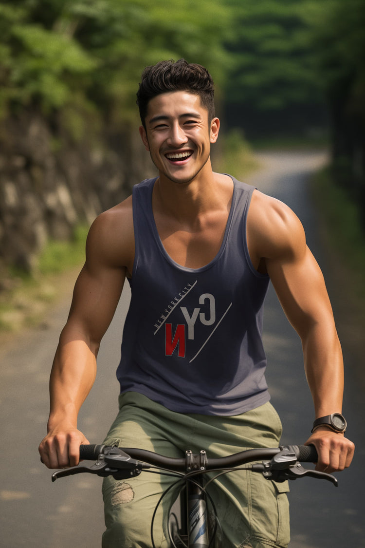 Man riding a bicycle on a road with greenery in the background