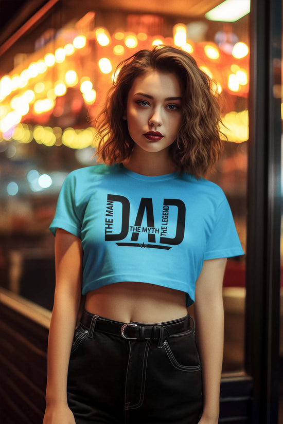 Woman wearing a blue t-shirt with text in an urban setting