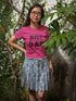 Person wearing a pink t-shirt with &