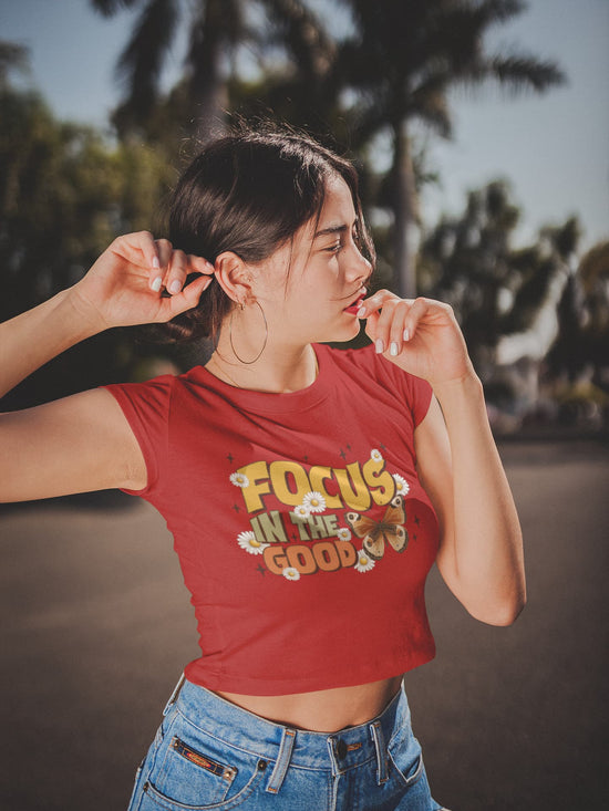 Woman wearing a red t-shirt with &