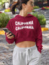 Woman wearing a maroon hoodie with &