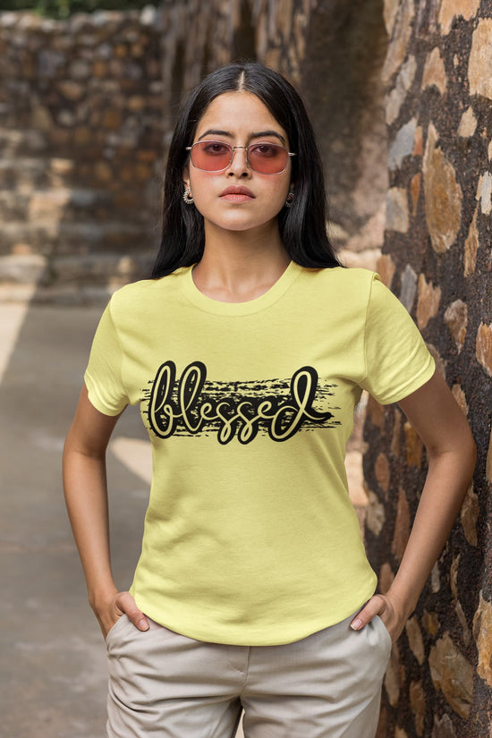 Woman wearing a yellow t-shirt with &