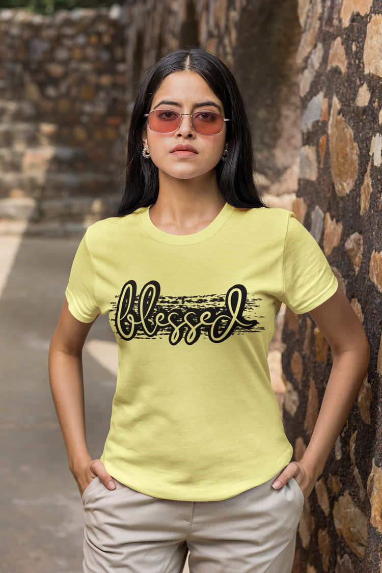 Woman wearing a yellow t-shirt with &