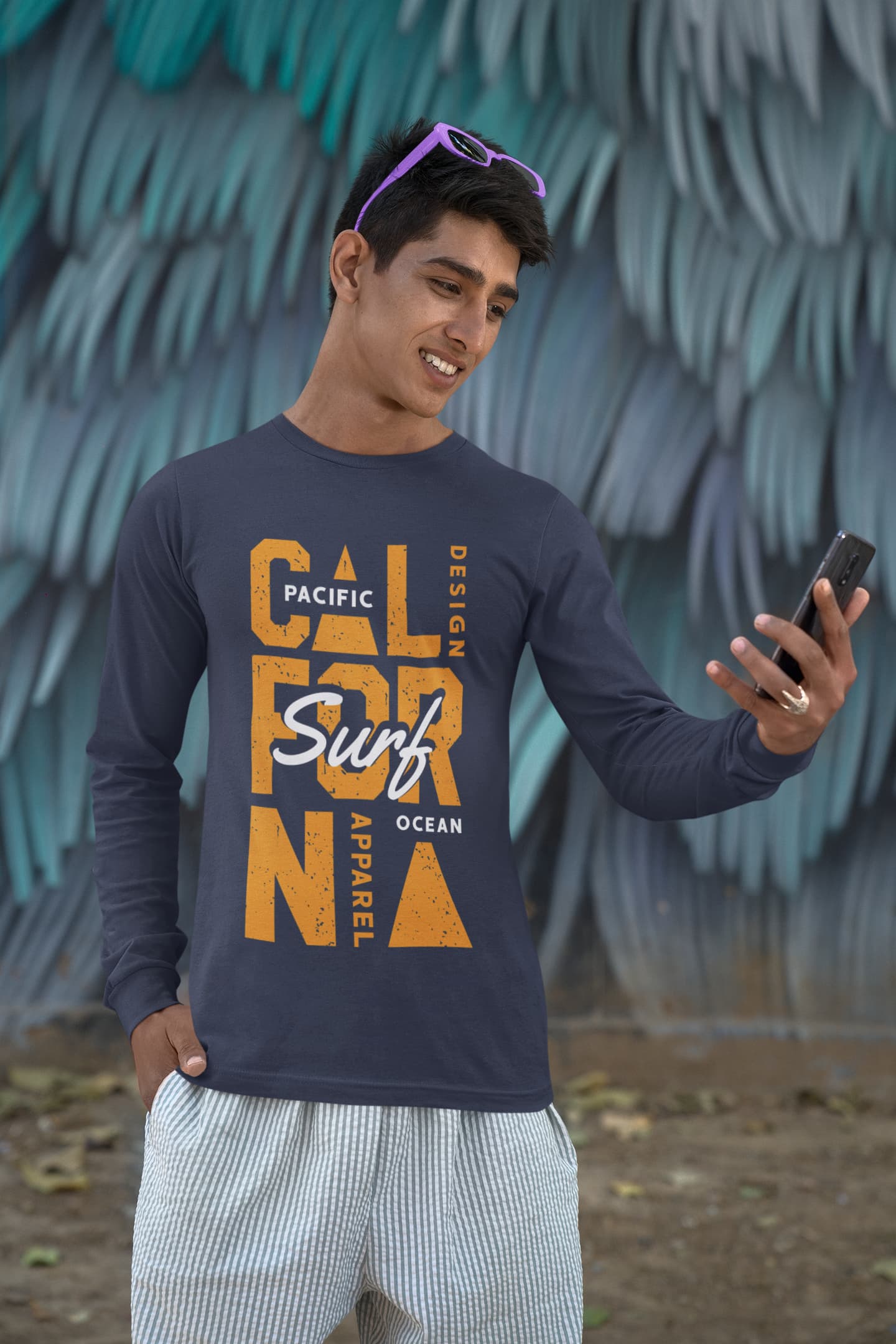 Person wearing a navy blue sweatshirt with &