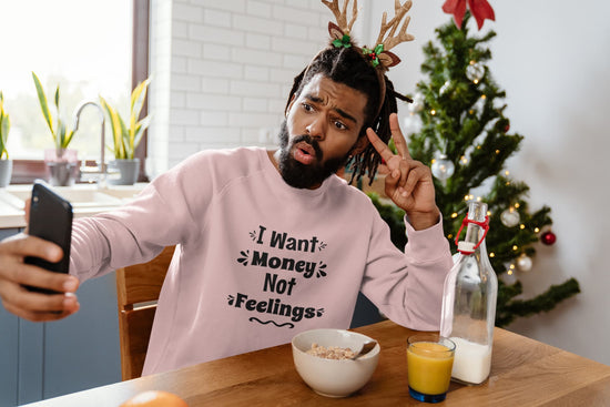 Person in a pink sweatshirt with a Christmas tree in the background