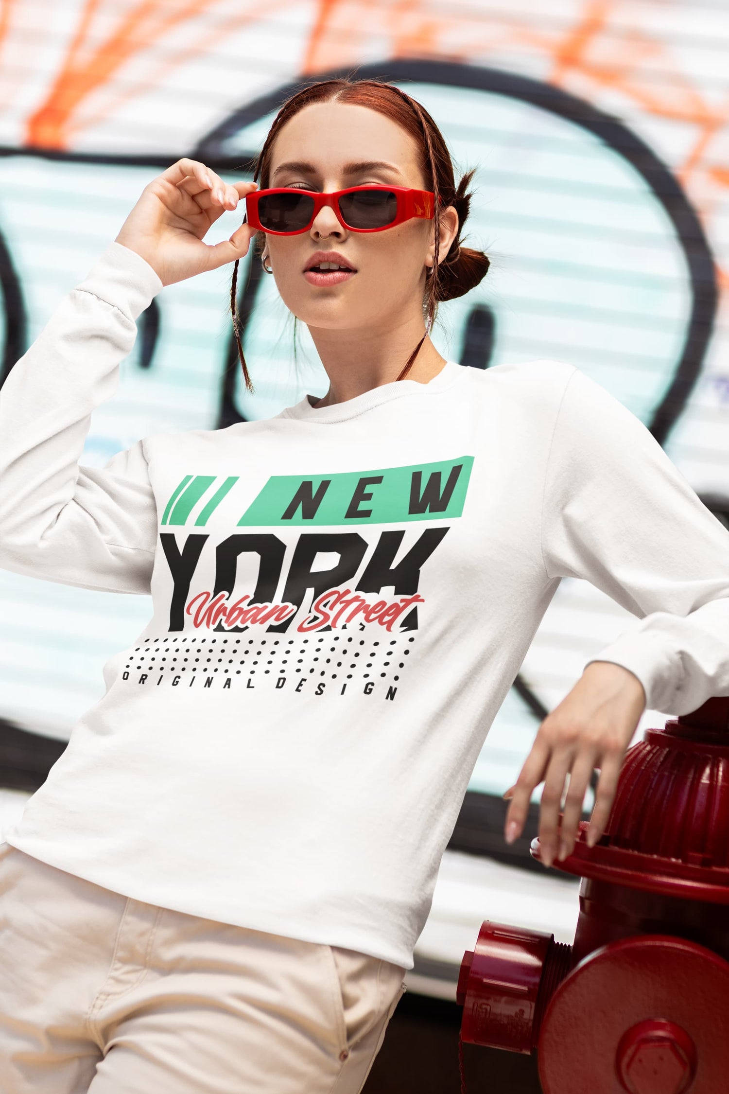 Person wearing a white sweatshirt with &