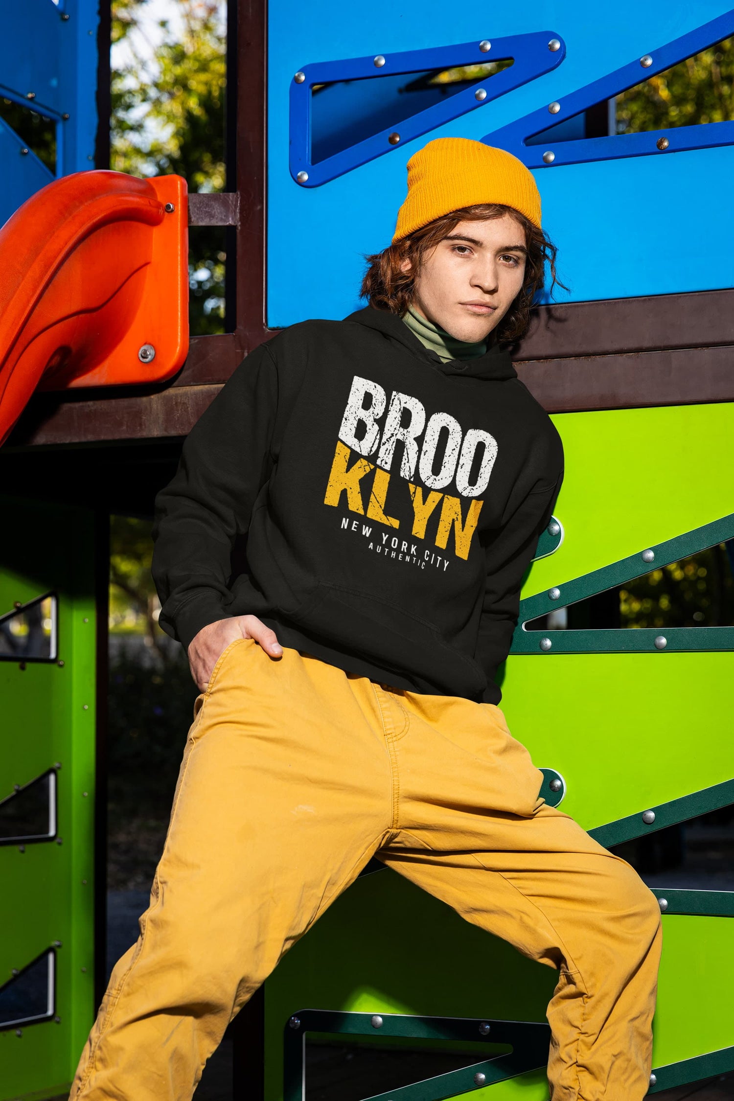Person wearing a black hoodie with &