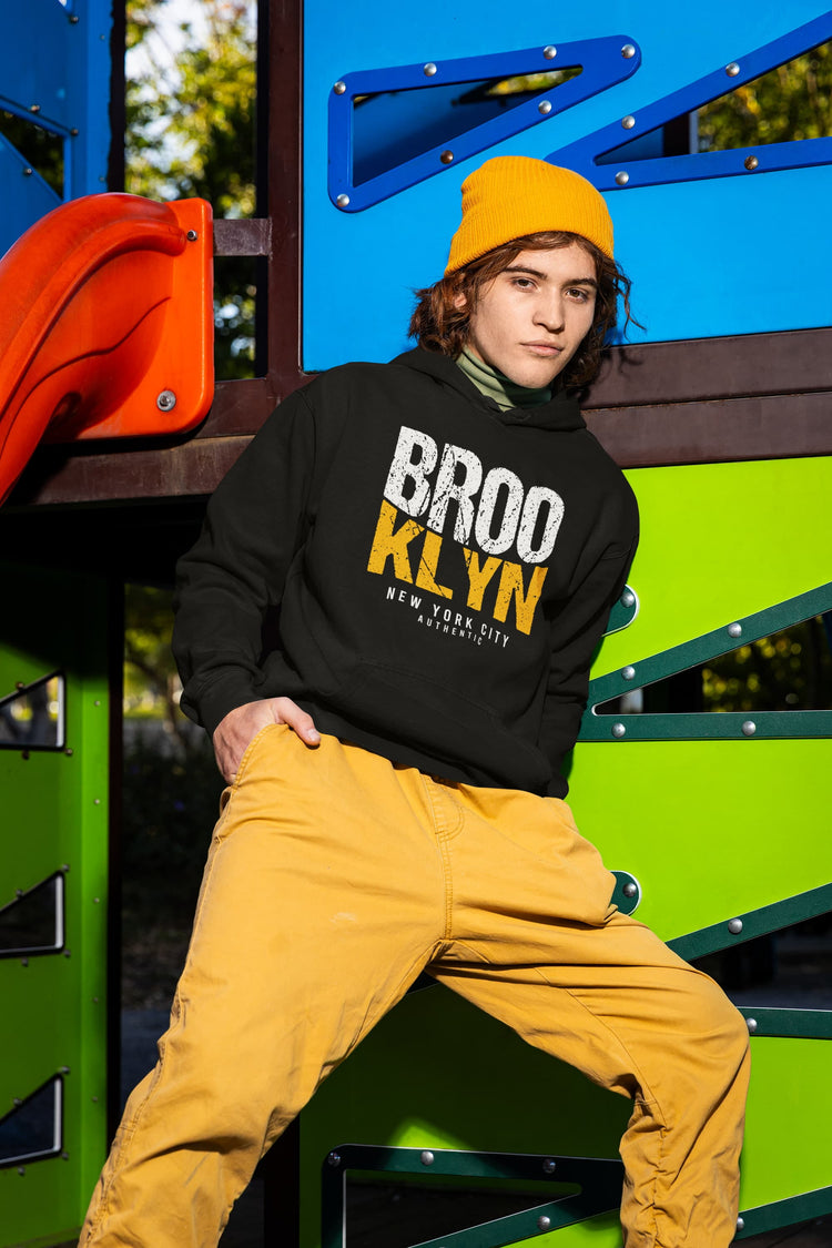 Person wearing a black hoodie with &