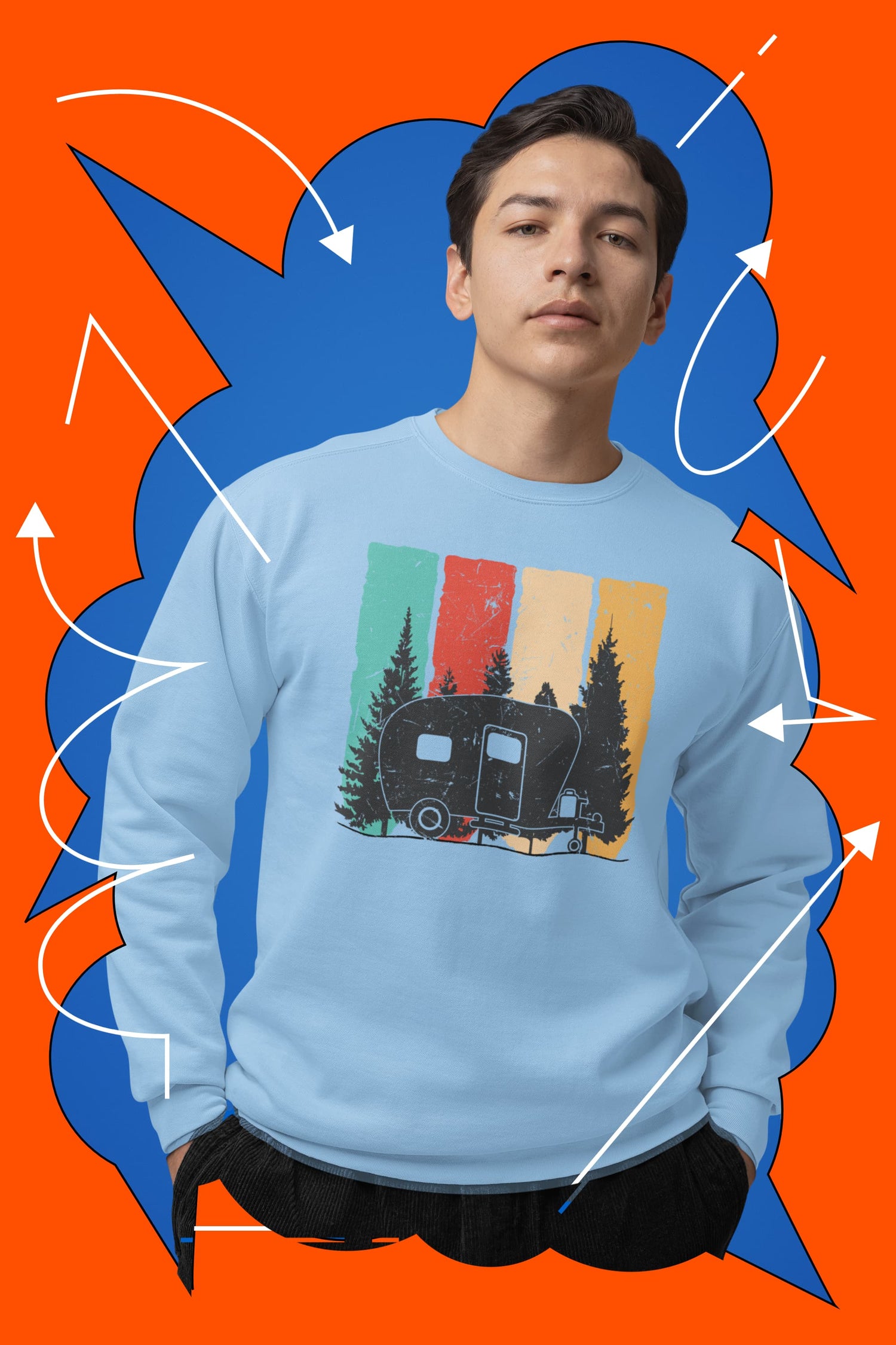 Person wearing a blue sweatshirt with a camper design against an orange and blue abstract background